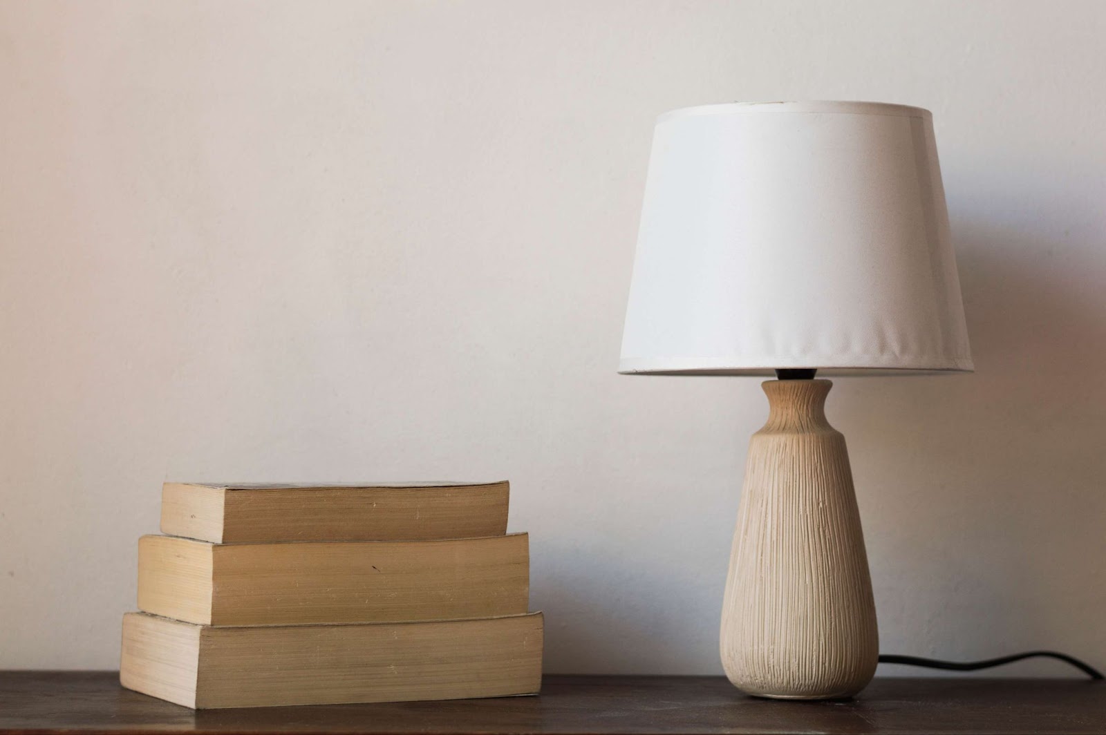 Desk lamp and books