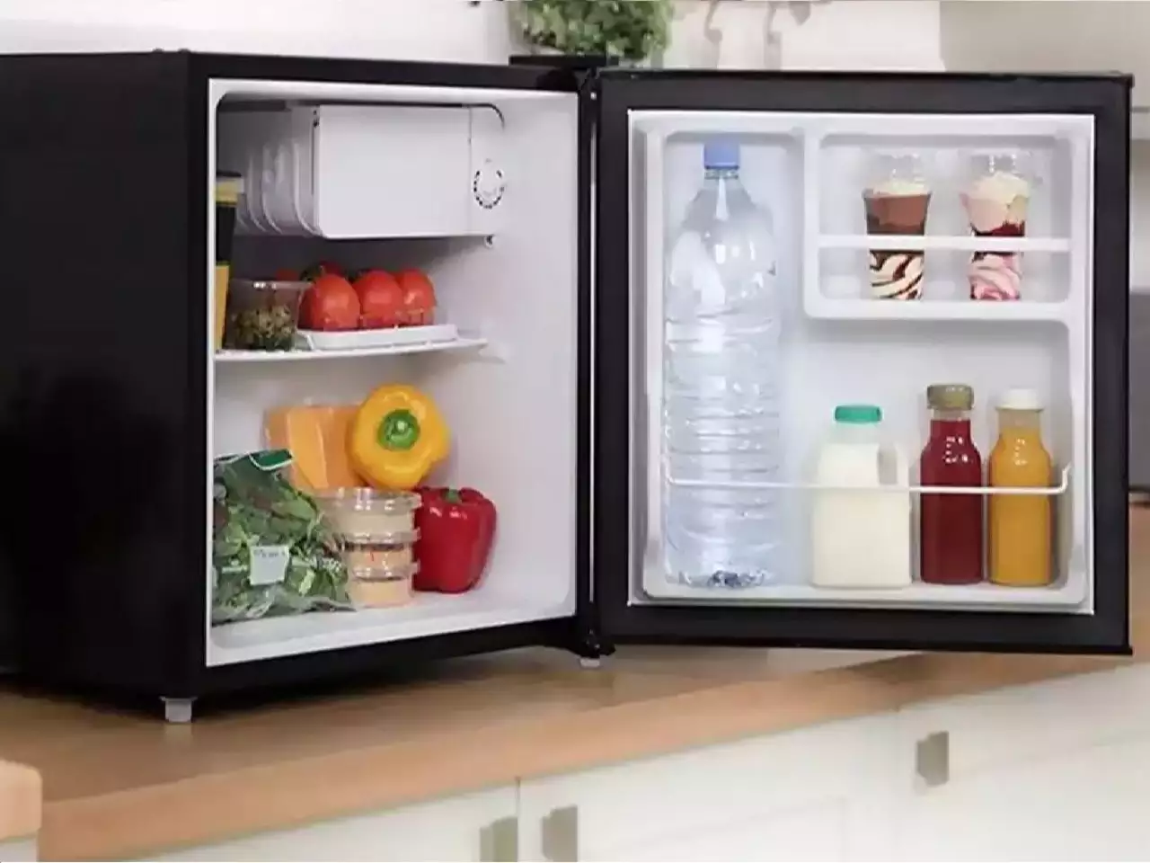 Opened Mini Fridge with Food