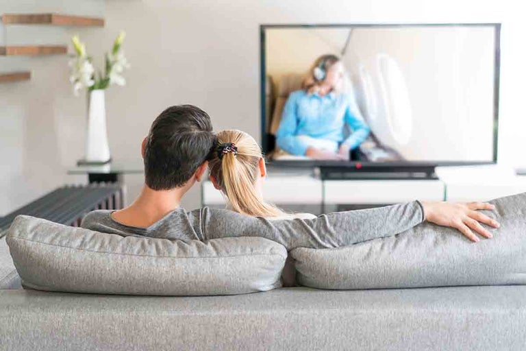 Couple watching tv together
