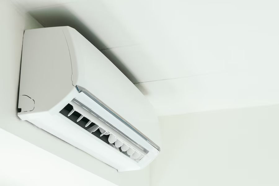 Split-type air conditioner near the ceiling in a close-up shot